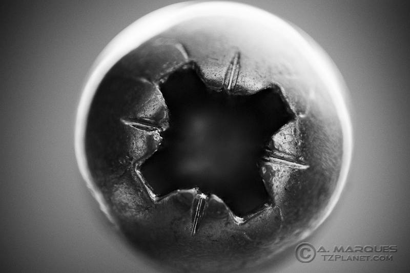 Up close on the Head - Extreme macro of a screw head with Phillips identions. The original object is about 5mm wide and the image was not cropped.